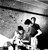 George Maciunas and Yoko Ono, Yoko Ono, Toshi Ichiyanagi, and Jonas Mekas, during Paintings & Drawings by Yoko Ono, AG Gallery, New York, 17–30 July 1961, printed 1993